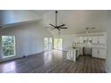 Spacious living room with wood floors, a ceiling fan, and bright, airy windows at Tbd Park St., Georgetown, SC 29440