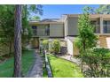 Exterior view of the condo featuring lush landscaping, and a private balcony at 1 Gate 1 # 1, Carolina Shores, NC 28467