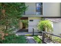 Welcoming condo entrance surrounded by lush greenery and a convenient walkway with railing at 1 Gate 1 # 1, Carolina Shores, NC 28467