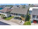 Aerial view of a charming beach house neighborhood, showcasing the coastal living environment at 161 Easy St., Garden City Beach, SC 29576