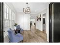 Elegant foyer featuring hardwood floors, decorative lighting, and a stylish seating area at 208 W Palms Dr., Myrtle Beach, SC 29579
