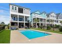 Inviting backyard pool surrounded by lush greenery, perfect for relaxing and entertaining guests at 208 W Palms Dr., Myrtle Beach, SC 29579