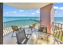 A charming balcony with panoramic ocean views and cozy furniture, perfect for relaxation and outdoor dining at 2500 N Ocean Blvd. # 1102, Myrtle Beach, SC 29577