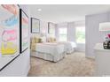 Shared bedroom with twin beds, colorful decor, and bright natural lighting at 2616 Elowen Ln. # 167B, Longs, SC 29568