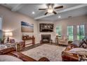Cozy living room with hardwood floors, fireplace, and decorative accents create a welcoming atmosphere at 3091 Viceroy Loop, Little River, SC 29566
