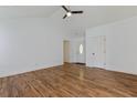 Open living space with hardwood floors, a front door, and neutral walls at 316 Watercress Dr., Longs, SC 29568