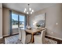 Elegant dining room featuring a wooden table, upholstered chairs, and a modern chandelier at 4019 Braid Ct., Myrtle Beach, SC 29588