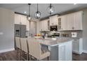 Well-appointed kitchen featuring granite countertops, stainless steel appliances, and a large island with seating at 4023 Braid Ct., Myrtle Beach, SC 29588
