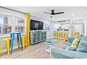 Bright living room with coastal decor, comfortable seating, and an open view to the kitchen at 4303 South Ocean Blvd. # 303, North Myrtle Beach, SC 29582