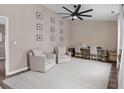 Inviting sitting area with neutral walls, a ceiling fan, and hardwood flooring. Perfect for relaxing or entertaining at 4639 Mandi Ave., Little River, SC 29566