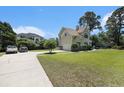 A traditional home with a long drive way and ample yard space at 5460 Huntington Marsh Rd., Murrells Inlet, SC 29576