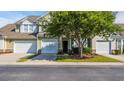 Inviting townhome with manicured lawn and attached garage, offering comfort and curb appeal at 6172 Catalina Dr. # 612, North Myrtle Beach, SC 29582