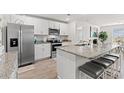 Modern kitchen featuring stainless appliances, granite countertops, and eat-in island at 1031 Corn Husk Loop, Conway, SC 29527