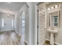 Bright entryway showcasing wood flooring, archways, and open access to the powder room at 1095 Laconic Dr., Myrtle Beach, SC 29588