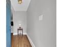 Inviting foyer with hardwood floors, neutral walls, and a decorative light fixture at 1155 Palmetto St., Georgetown, SC 29440