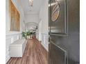 Inviting foyer with hardwood floors, arched doorways, and elegant wainscoting at 116 Glengrove Lane, Murrells Inlet, SC 29576