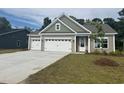 Attractive home with a two-car garage and well-maintained lawn in a desirable neighborhood at 118 Westfield Circle, Conway, SC 29526
