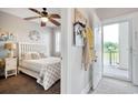 Cozy bedroom featuring a ceiling fan and access to a private balcony at 121 Waypoint Ridge Ave. # P-15, Little River, SC 29566
