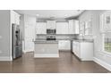 Modern kitchen featuring stainless steel appliances, granite countertops and ample white cabinetry at 1600 Palmetto Palm Dr., Myrtle Beach, SC 29579