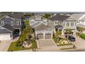 Beautiful community with multiple homes, green grass and palm trees around with a car parked in the driveway at 201 West Isle Of Palms Ave., Myrtle Beach, SC 29579