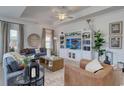 Bright and airy living room featuring stylish furniture and a decorative ceiling fan at 227 Sundrop Way, Conway, SC 29526