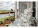 Relaxing waterfront porch with comfortable seating and scenic views offers a tranquil outdoor living space at 4396 Baldwin Ave. # 1, Little River, SC 29566