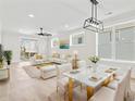 Bright, open-concept living and dining area featuring modern furnishings and lots of natural light at 4617 Hedrick St., North Myrtle Beach, SC 29582