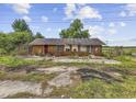 Single story brick home with overgrown landscaping and neglected surroundings at 4860 Highway 378, Conway, SC 29527