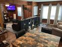 Spacious living area with a dining table, comfortable seating, and lots of natural light at 514 Palm St., Georgetown, SC 29440