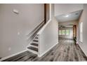 The bright entryway features hardwood floors, a stairway, and an open floor plan at 5153 Country Pine Dr., Myrtle Beach, SC 29579