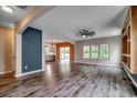 Spacious living room with hardwood floors, a ceiling fan, and ample windows at 5153 Country Pine Dr., Myrtle Beach, SC 29579