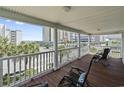 Inviting outdoor porch with comfortable seating overlooking the beach at 5407 N Ocean Blvd., Myrtle Beach, SC 29577