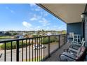 Enjoy the view from this large balcony with comfortable seating, overlooking waterway and parking at 5905 S Kings Hwy. # 242B, Myrtle Beach, SC 29575