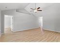 Spacious living room with plank flooring, high ceilings, and neutral paint at 600 Woodside Dr., Conway, SC 29526