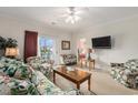 Comfortable living room with a ceiling fan and a view of the bedroom at 604 Heathrow Dr. # 1101, Myrtle Beach, SC 29579
