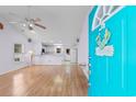 Bright living room with hardwood floors and view to kitchen at 613B 3Rd Ave. S, North Myrtle Beach, SC 29582