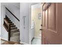 Inviting entryway with staircase and access to a half bath, offering convenience and style at 614 15Th Ave. S # 41, Surfside Beach, SC 29575