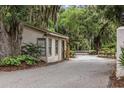 Exterior view of the community's guard house with security gate and lush greenery at 64 Bamboo Loop # 161, Georgetown, SC 29440