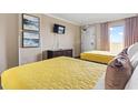 Well-appointed bedroom with two cozy beds, flat-screen TV, and a view of the ocean at 6900 North Ocean Blvd. # 938, Myrtle Beach, SC 29572