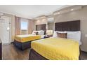 Comfortable bedroom with two beds, soft lighting, and calming decor for a restful stay at 6900 North Ocean Blvd. # 938, Myrtle Beach, SC 29572
