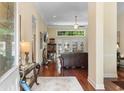 Welcoming entryway leading into a spacious living area with hardwood floors, neutral paint, and lots of natural light at 702 Compass Pointe Dr, North Myrtle Beach, SC 29582