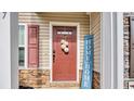 Inviting front door with decorative wreath and 'HOME Sweet HOME' sign at 837 Triple Ct. # 837, Myrtle Beach, SC 29588