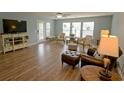 Inviting living room with hardwood floors, large windows, and comfortable seating at 9 Pistachio Loop # B, Murrells Inlet, SC 29576