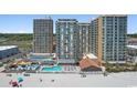 Aerial view of oceanfront condos with a large pool and beach access at 9550 Shore Dr. # 1523, Myrtle Beach, SC 29572
