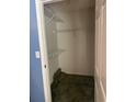 View of a well-lit walk-in closet with shelving and carpet at 9779 Leyland Dr. # 3, Myrtle Beach, SC 29572