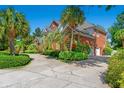 Gorgeous brick home featuring a long driveway and well-maintained landscaping at 1119 Links Rd., Myrtle Beach, SC 29575