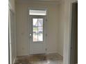 Bright entryway with a white door and transom window, offering a glimpse of the outdoors at 122 Westfield Circle, Conway, SC 29526