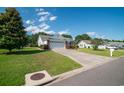 A home with great curb appeal, featuring a well-maintained lawn and driveway leading to a two-car garage at 1388 Gailard Dr., Conway, SC 29526
