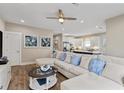 Spacious living room with a large sectional, wood floors and open to the kitchen at 141 Marblehead Dr., Little River, SC 29566