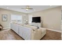 Comfortable living room featuring a sectional, wood floors and plenty of natural light at 141 Marblehead Dr., Little River, SC 29566